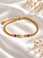 Armband mit goldenen Perlen und Grün/Pink Perlen
